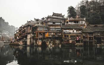 brown wooden houses beside river